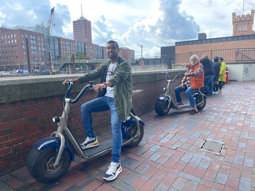 2 Hours Hamburg E-scooter Tour - Speicherstadt trades open waterfront for brick canals