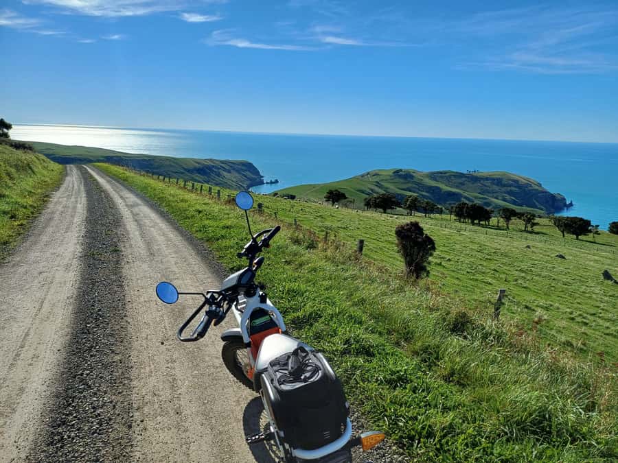 Akaroa: Lonely Beach Trail by E-Scooter. selfguided day out - Organic wine at Takamatua Valley Wines
