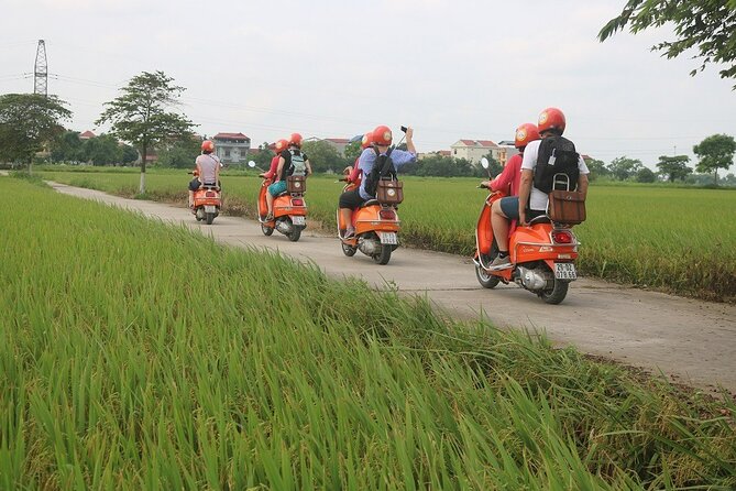 Beautiful Female Riders Vespa Red River Countryside Tour 5 Hours - A fruit farm, local family, and countryside lunch