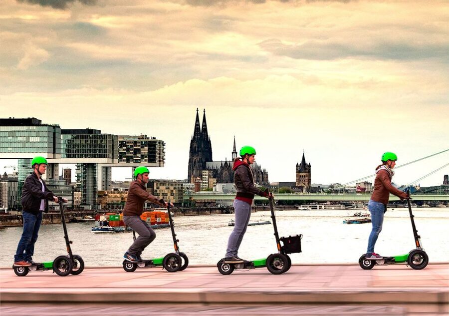Cologne: Guided E-Scooter Tour - Crossing the Hohenzollern Bridge toward the Cathedral