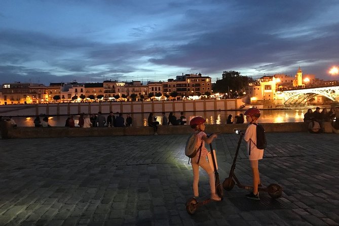Electric Scooter Rental Seville - Returning past the Tobacco Factory and Alcazar