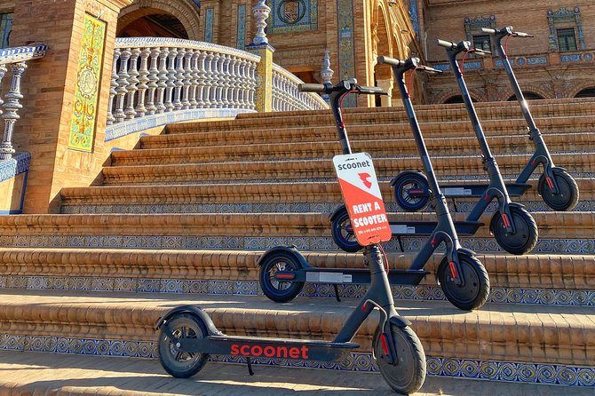 Electric Scooter Rental Seville - Along the river and across Triana Bridge