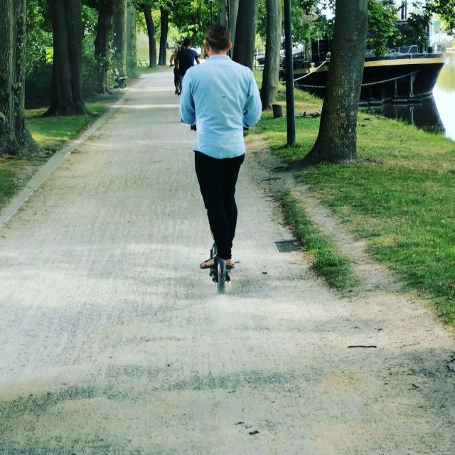 From Bruges to Damme: Private Electric Scooter tour - Riding toward Damme by electric scooter