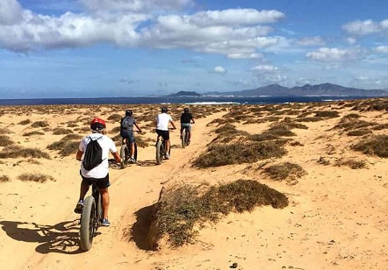 From Corralejo: Fuerteventura Guided E-Bike/E-scooter Tour - Bayuyo and Calderon Hondo: the main volcanic stop