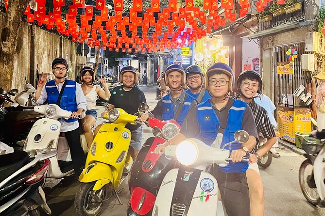 Hanoi After Dark Vespa Tour (4 hours): Street Food & Night Vibes - Hanoi at 6 PM, seen from the back of a Vespa