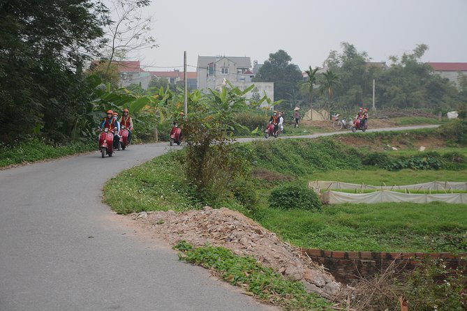 Hanoi Back Street Vespa Tours: Full Day Vespa Tours - Walking beside the railway in Duong Tau