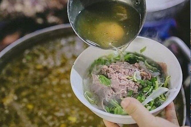 Hanoi Street Food tour by Scooter – Local Experience - A drink inside an old Hanoi apartment