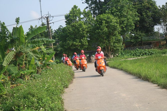 Hanoi Vespa Full Day City & Countryside with Female Ao Dai Riders - Railway homes at Duong Tau