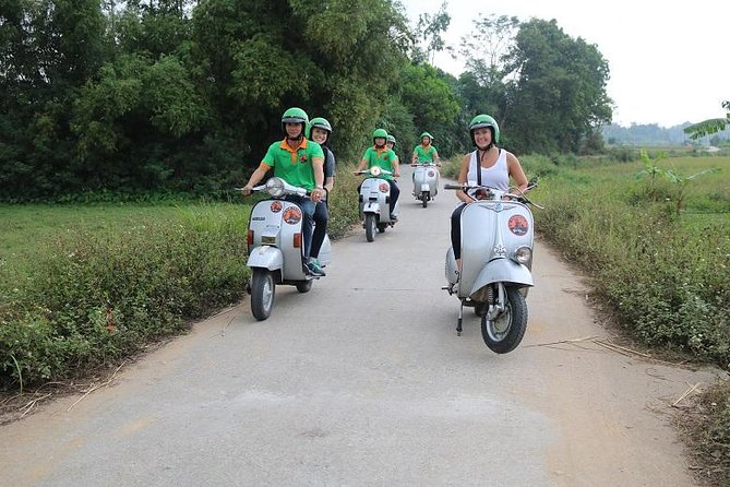 Hanoi Vespa Tour Explore Red River Delta & Rural Villages 5 Hours - Leaving Hanoi by vintage Vespa