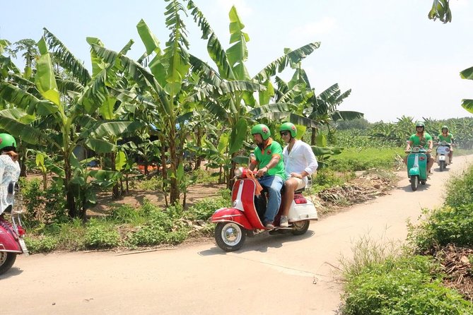 Hanoi Vespa Tour Explore Red River Delta & Rural Villages 5 Hours - Long Bien Bridge gives the ride a strong opening