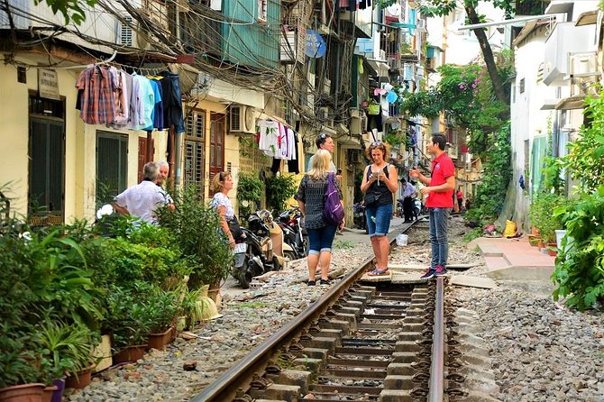 Hanoi Vespa Tours: Full Day Hanoi City & Countryside Vespa Tours - Leaving Hanoi through Dong Xuan and Long Bien Bridge