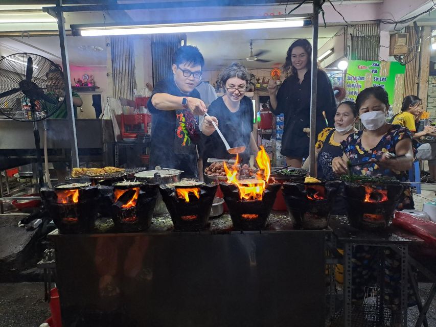 Ho Chi Minh City: Food Tour by Scooter with Eleven Tastings - District 10 street snacks and a walk between bites
