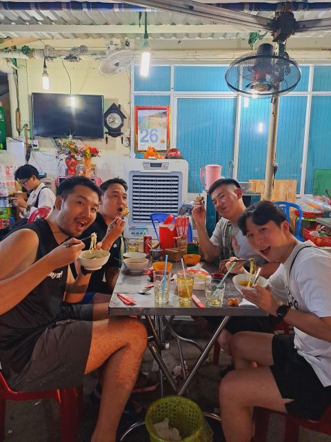 Ho Chi Minh City: Food Tour by Scooter with Eleven Tastings - Old apartments, sugarcane juice, and Hue beef noodles