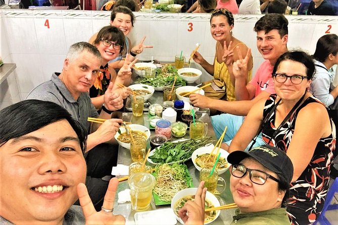 Ho Chi Minh city Street Food by scooter tour | female driver - Vietnamese pancake, cooked and eaten the local way