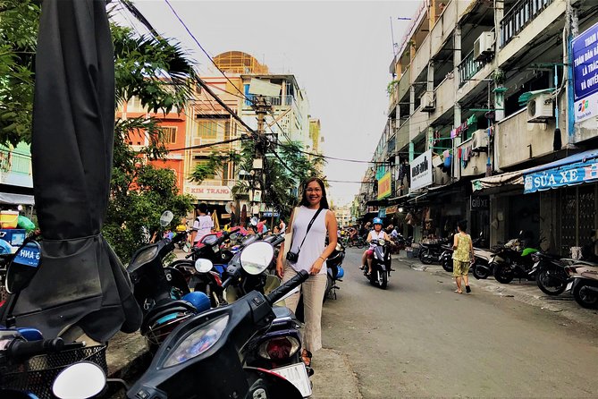 Ho Chi Minh city Street Food by scooter tour | female driver - Flowers, food, and the city after dark