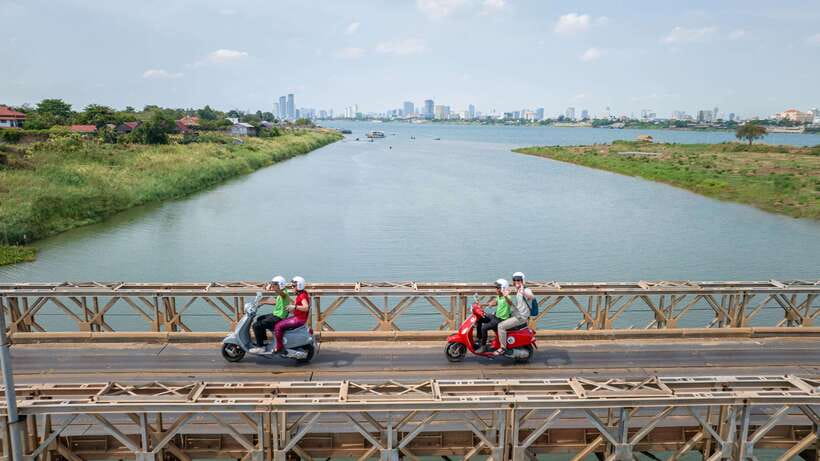 Phnom Penh: Silk Island Tour by Vespa with Tuk Tuk Available - Ferry crossings and the view back toward the city