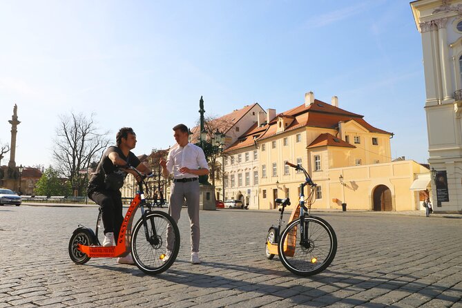 Prague Trike & e-Scooter Tour: Castle Viewpoints & Charles Bridge - The narrow street and Kafka’s curious statues
