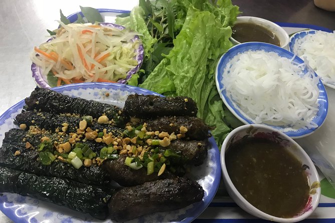 Private Saigon Night Food Tour by Scooter - Stop three: Ho Thi Ky Flower Market and Vietnamese pizza