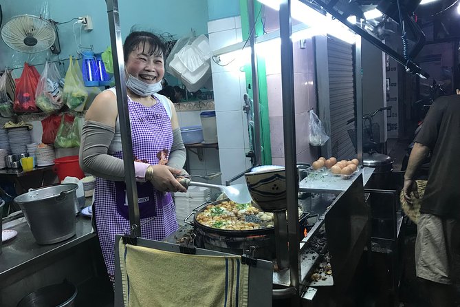 Private Saigon Night Food Tour by Scooter - Stop two: beef noodle soup or crab noodle soup
