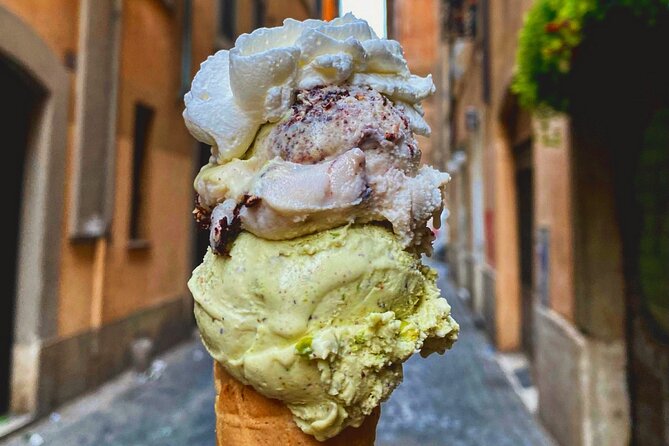 Rome Afternoon Sightseeing Vespa Sidecar Tour with Gourmet Gelato - Piazza Venezia and the Colosseum from the road