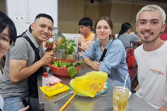 Saigon Food Tour by Scooter with Eleven Tastings - Walking through District 10’s food streets