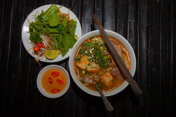 Saigon Night Street Food and City Tour on Scooter - A moving break through Ho Chi Minh City