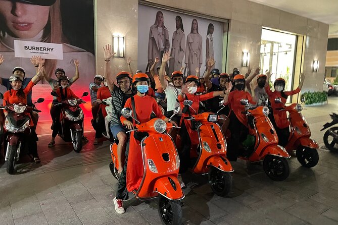 Saigon Vespa By Night Street Food With Female Riders Ao Dai - Riding through the city between stops