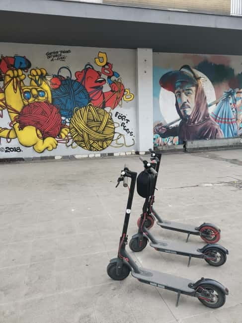 Street Art E Scooter tour - Art on walls, poles, and electrical boxes