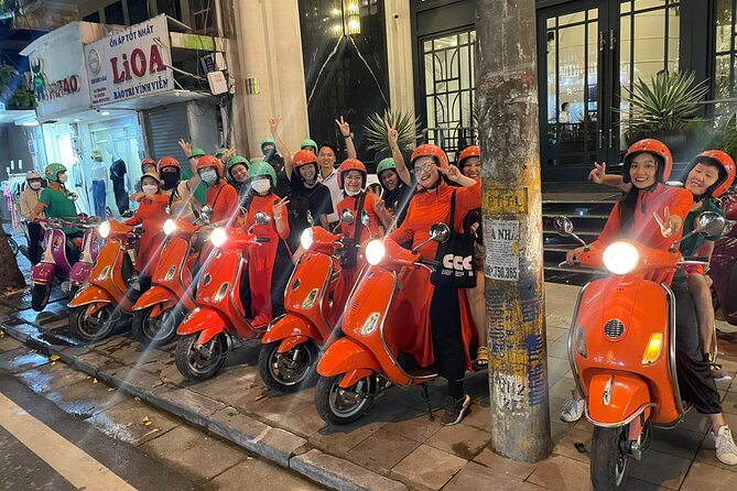 Vespa Female Ao Dai riders Night Street Food + See Train Street - The Opera House and Hanoi’s evening streets